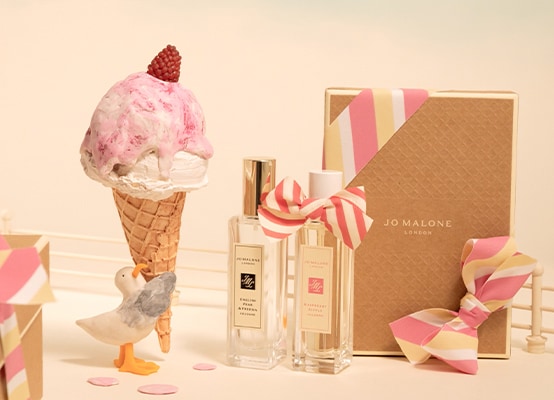 A stop motion videos shows a seagull carrying an icecream cone that drips alongside two Jo Malone London cologne bottles. 